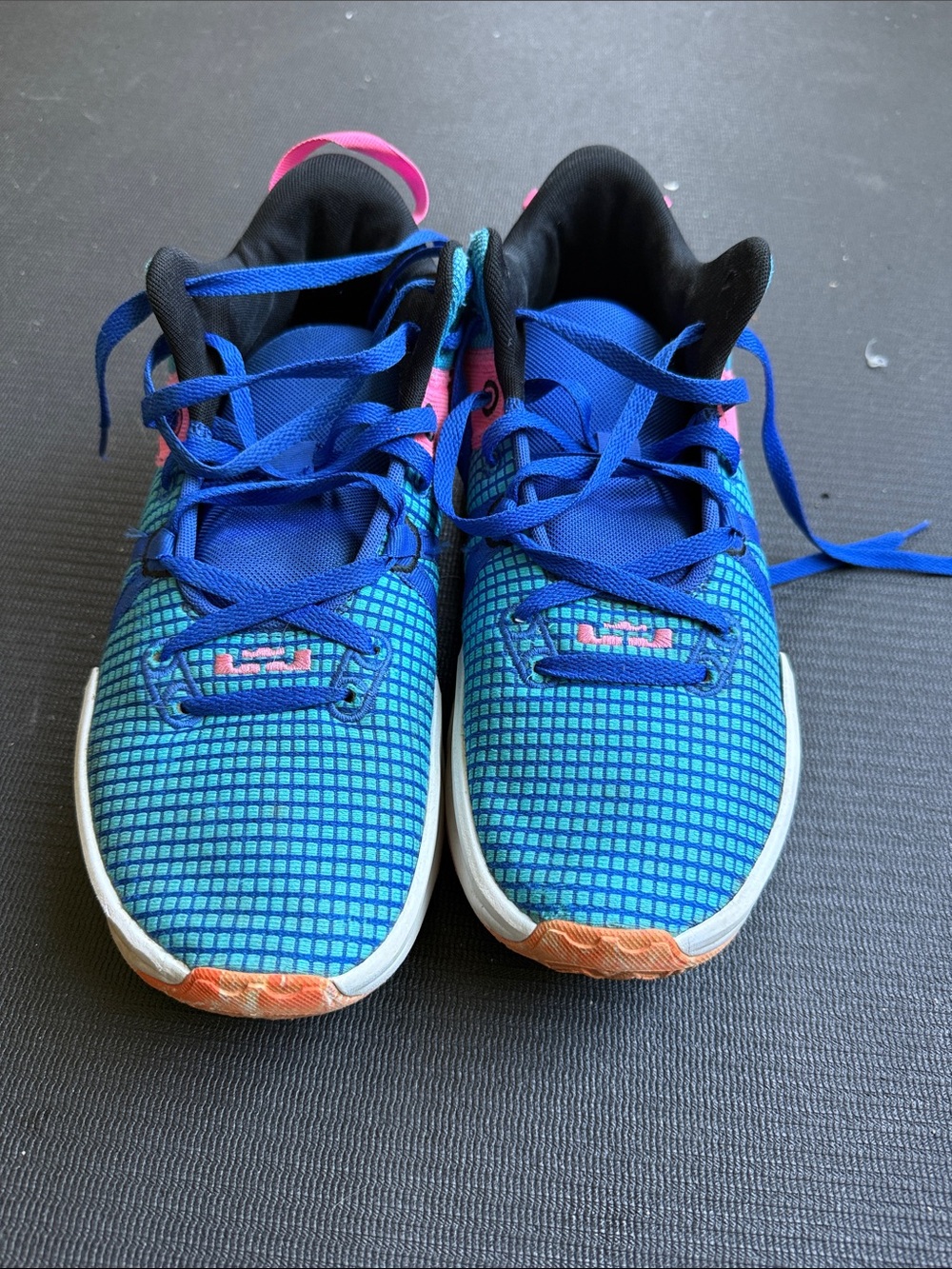 Nike Blue Athletic Shoes with Pink and Orange Accents